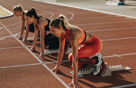 Gentleman sitting hunched over at a desk angrily tying at an old computer.